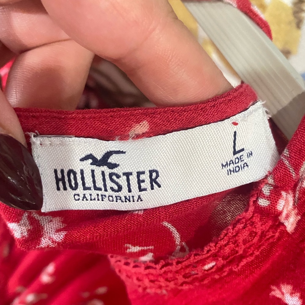 4/$25*Hollister, featuring a V-neck, peplum hem, and long flared sleeves. L - Picture 7 of 7